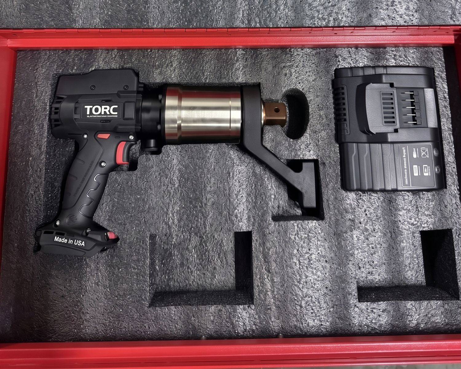 TORC TBT Series cordless torque wrench with battery and charger, packed in a hard case